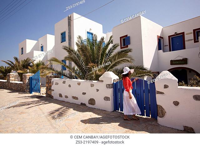 Tourist woman in front of a typical Cyclades house, Koufonissi, Cyclades Islands, Greek Islands, Greece, Europe