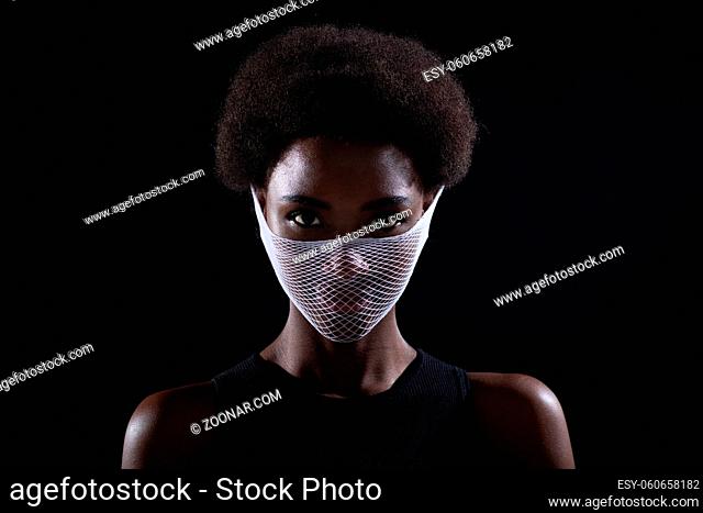 Portrait of african american dark skin woman fashion model quarantine medical fishnet knitting face mask coarse mesh net