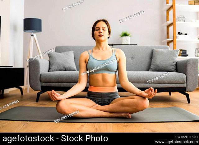 Healthy Yoga Fitness Meditation. Woman In Lotus Pose