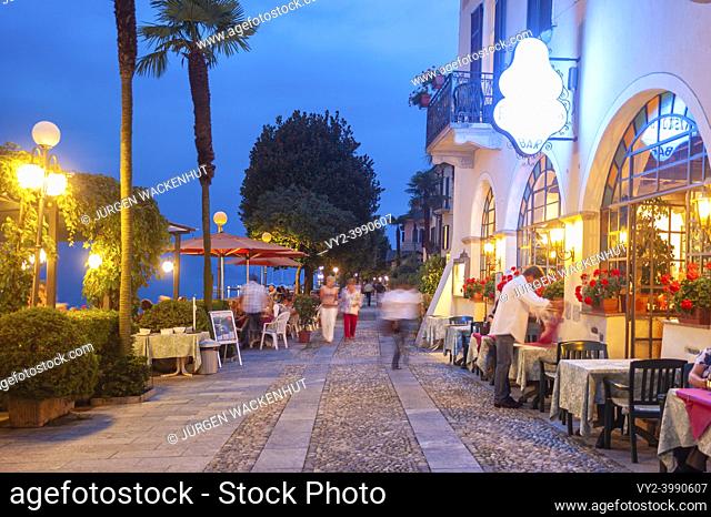 Promenade and restaurant on the shore of Lake Maggiore, Cannero Riviera, Piedmont, Italy, Europe