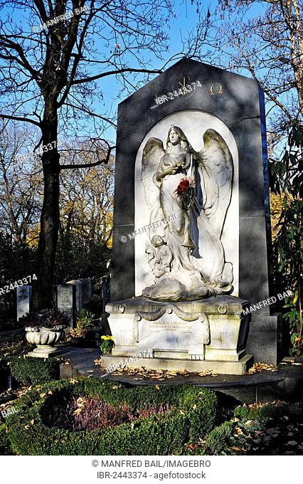 Grave with autumn leaves, Ostfriedhof cemetery, Munich, Bavaria, Germany, Europe