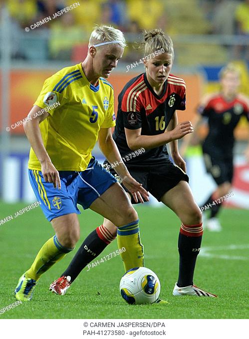 Melanie Leupolz (r) of Germany fights for the ball with Nina Fischer of Sweden during the UEFA Women's EURO 2013 semi final soccer match between Germany and...