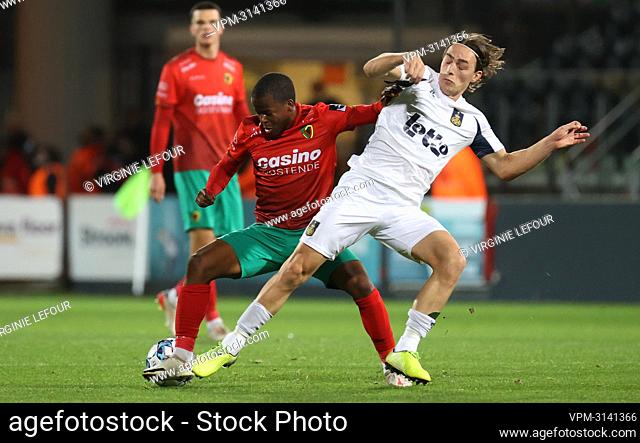 Oostende's Alfons Amade and Union's Casper Nielsen fight for the ball during a soccer match between KV Oostende and Royale Union Saint-Gilloise