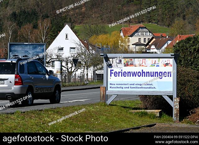 04 April 2020, Hessen, Affoldern: A signboard advertises holiday apartments. Owners of second homes in the North Hessian holiday region around Lake Edersee must...