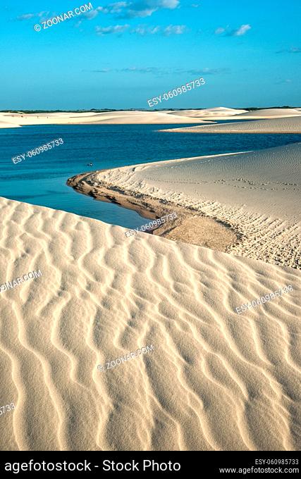 Lencois Maranhenses National Park, Brazil, low, flat, flooded land, overlaid with large, discrete sand dunes with blue and green lagoons