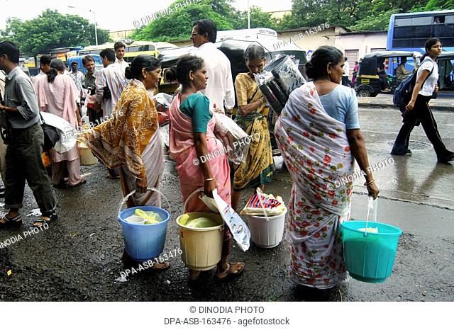 Local poor residents get relief materials in Ghatkopar ; Bombay Mumbai ; Maharashtra ; India 26-July-2005 NO MR