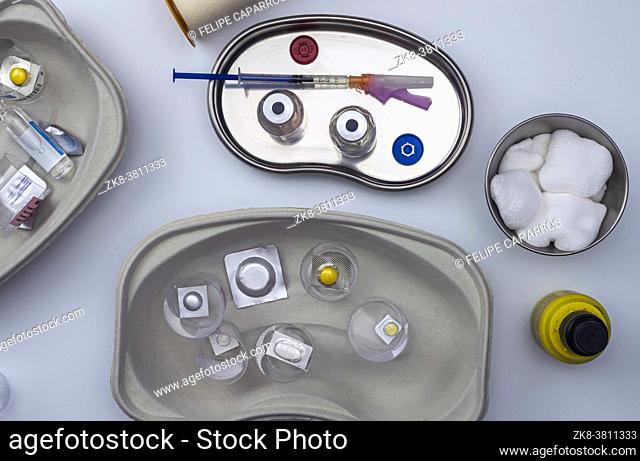 Diverse medication in glasses monodose in hospital, conceptual image