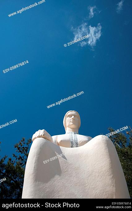 Famous landmark monument statue of the Cypriot mother or mana statue at Palaichori village in Cyprus. The statue is situated at a hill above the village of...