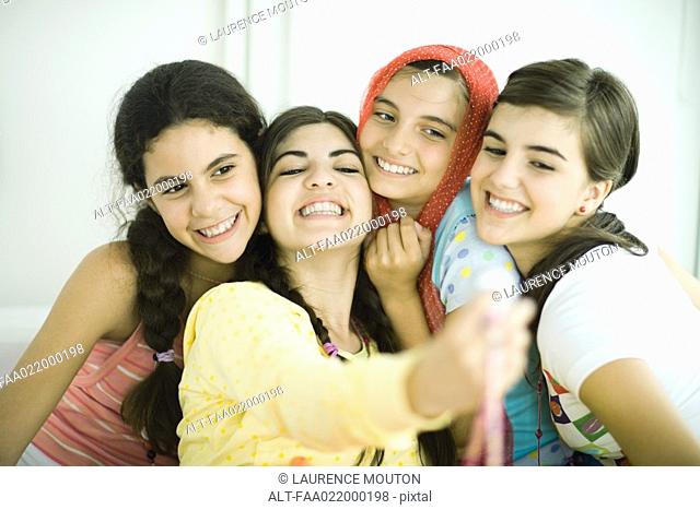 Young female friends posing for photo together