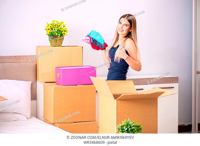 Young woman moving to new place