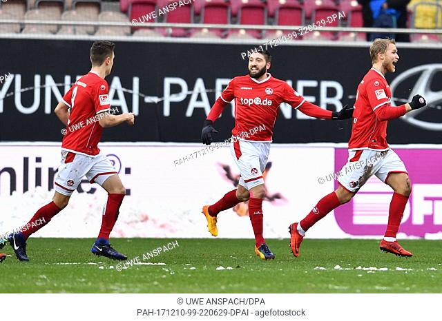 Kaiserslautern's SebaStian Andersson (R) and Brandon Borrello (C) celebrating Andersson's scoring of the opening goal during the German 2nd Bundesliga soccer...
