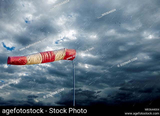 Air sock measuring the wind speed at stormy weather. Hurricane, tornado and storm concept