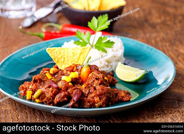 tasty chili con carne on wood