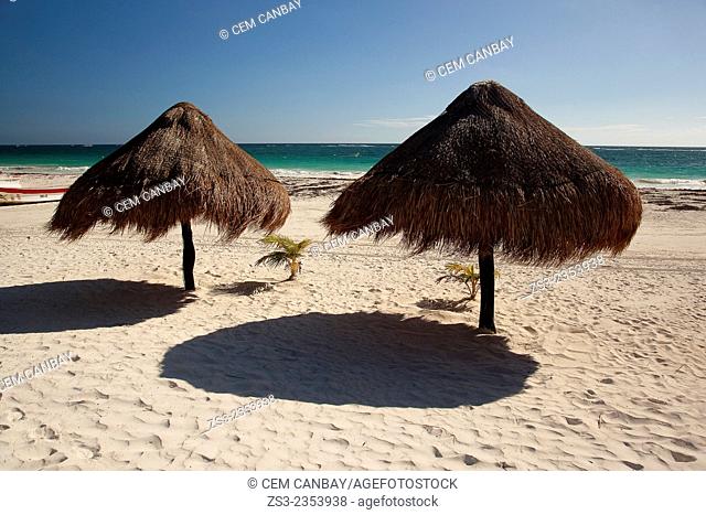 Thatched parasols at the beach, Tulum, Quintana Roo, Yucatan Province, Mexico, Central America