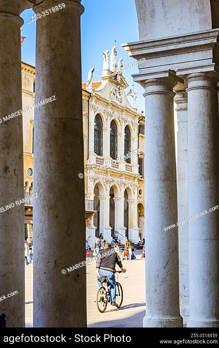 View of the facade of the church of San Vincenzo from an arch of the Paladian basilica. Basilica Palladiana. Piazza dei Signori, Vicenza, Veneto, Italy, Europe