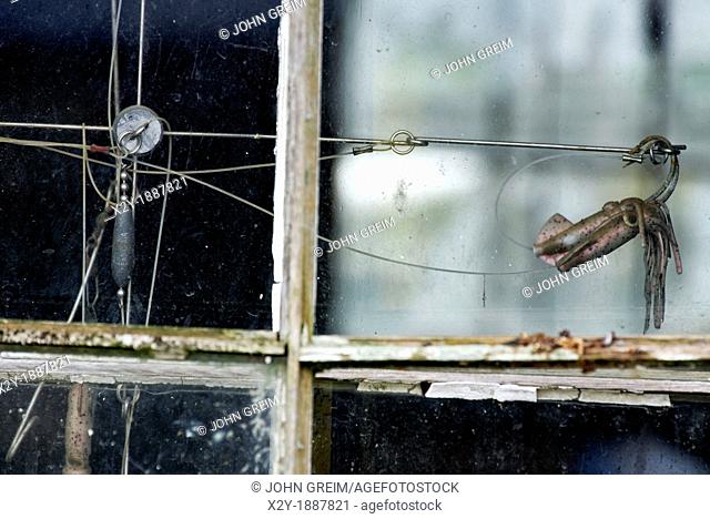Hooks and lures in a fishing shack window, Menemsha, Chilmark, Martha's Vineyard, Massachusetts, USA