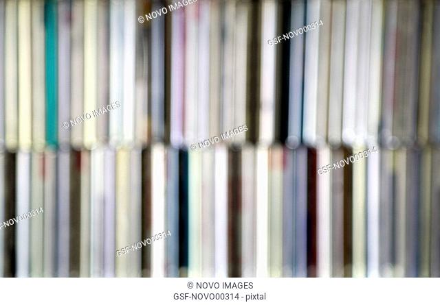 Blurred CD Collection on Shelves