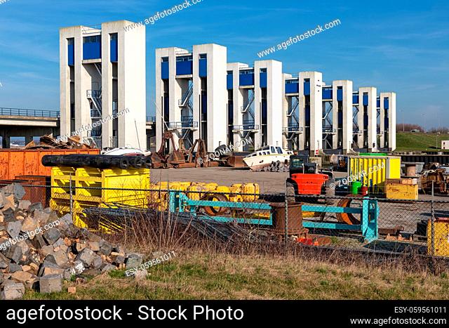 Discharge sluices in Houtribdijk and industrial storage area near Lelystad, The Netherlands