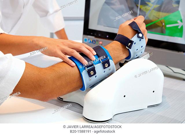 Investigator and patient with assistive robot for upper limb rehabilitation at home  This device is particularly suitable for patients who have suffered a...