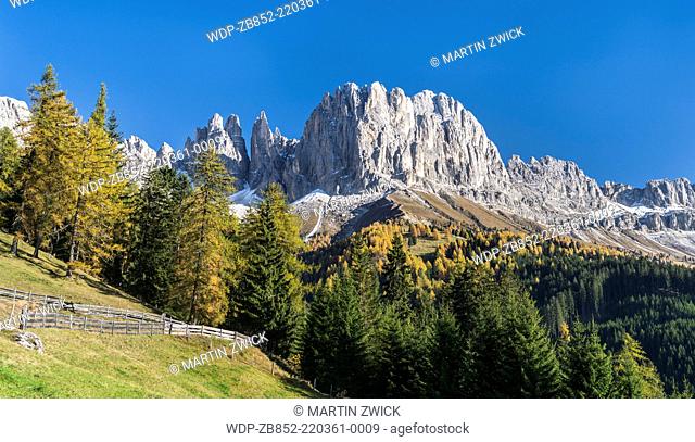 Rosengarten also called Catinaccio mountain range in the Dolomites of South Tyrol (Alto Adige) during autumn. The Vajolet Towers and the rock face of mount...