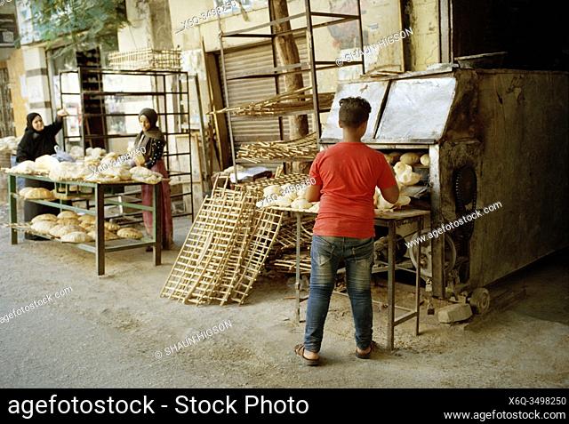 Bread making street stall in Islamic Cairo district of the city of Cairo in Egypt in North Africa