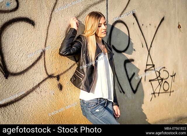 Young woman in casual clothes in an industrial area