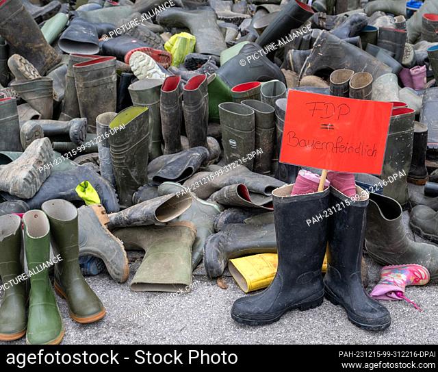 12 December 2023, Bavaria, Munich: More than a thousand rubber boots lie in front of the FDP district office. In a state-wide day of action