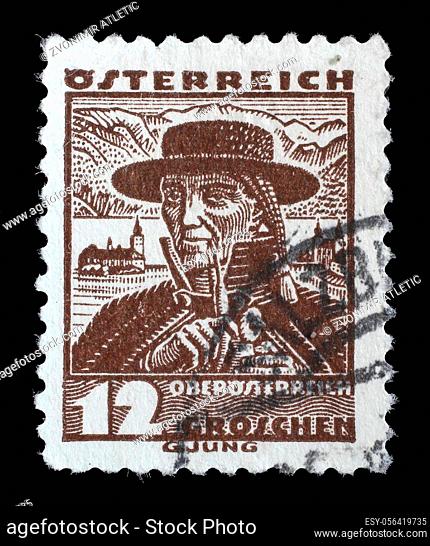 Stamp printed in Austria shows a man in the Austrian national dress with the inscription ""Upper Austria"" from the series ""Austrian national costume""
