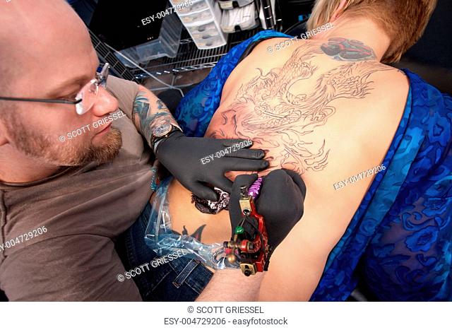 Tattoo Artist Creates a Design