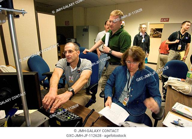 Astronauts Donald R. Pettit (left), STS-126 mission specialist; Eric A. Boe (standing), pilot; and Sandra H. Magnus, Expedition 18 flight engineer