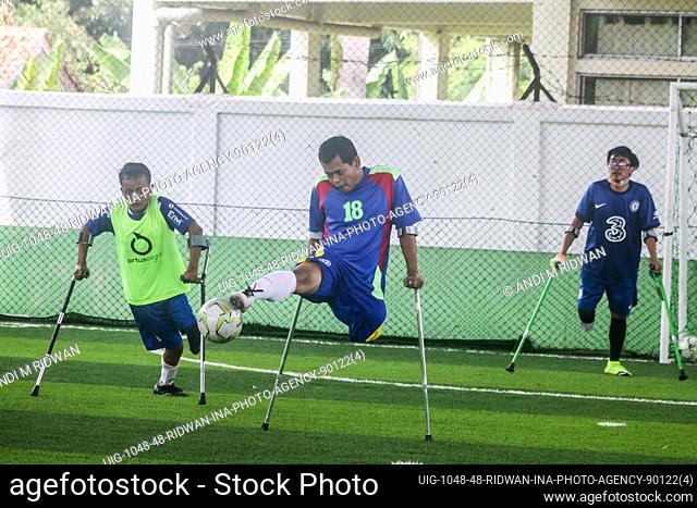 Indonesian amputees football player take part in a training session in a field in Bogor on January 9, 2022. The exercise was carried out as a means of...