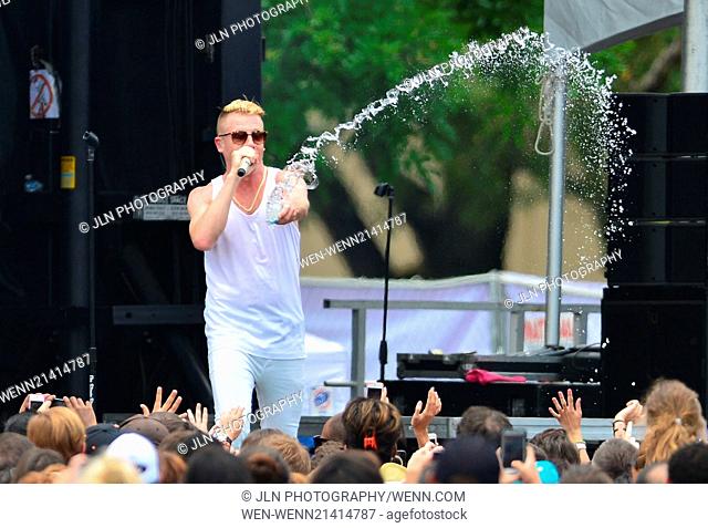 Macklemore and Ryan Lewis performing live on stage at Aventura Mall Parking Lot Featuring: Macklemore Where: Aventura, Florida