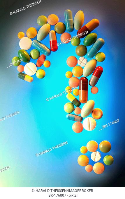 Question mark made from many different colourful pills and capsules