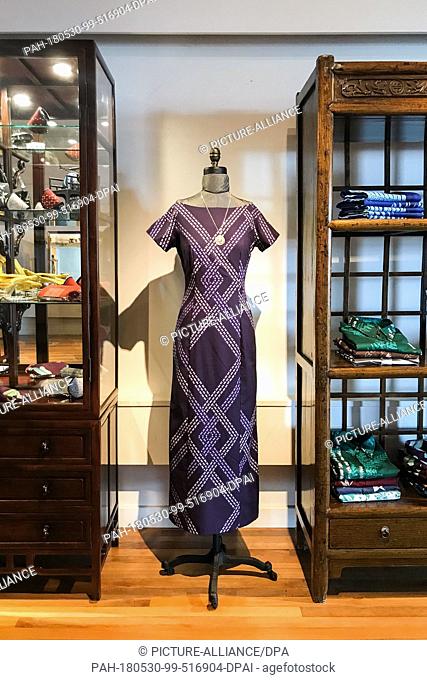 08 May 2018, US, Hawaii, Hilo: A dress is exhibited in the shop of designer Sig Zane. Sig Zane uses very traditional fabrics