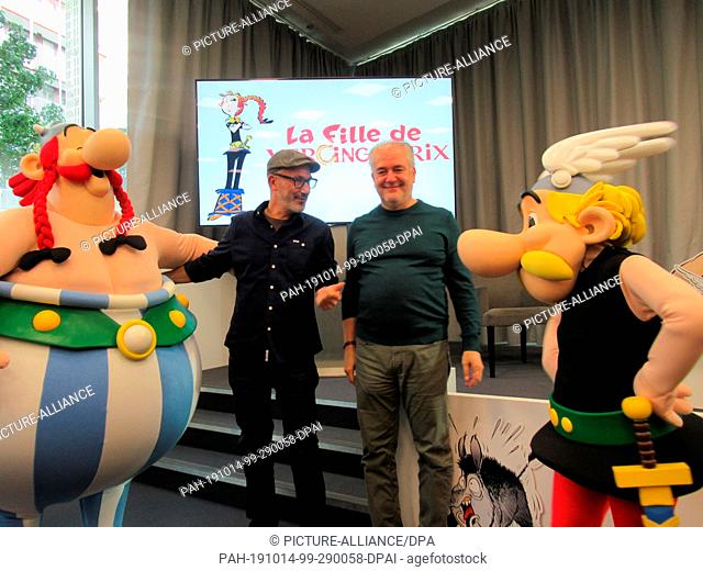 13 December 2019, France (France), Vanves: Didier Conrad (r), illustrator of the Asterix and Obelix figures, and Jean-Yves Ferri, copywriter