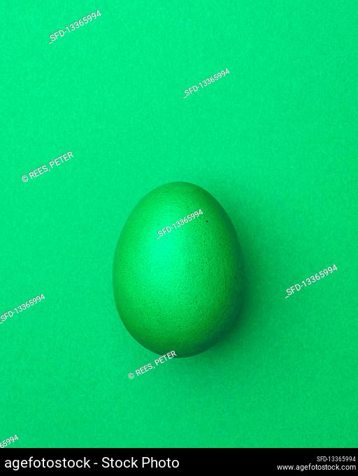 Light green Easter egg on a light green background