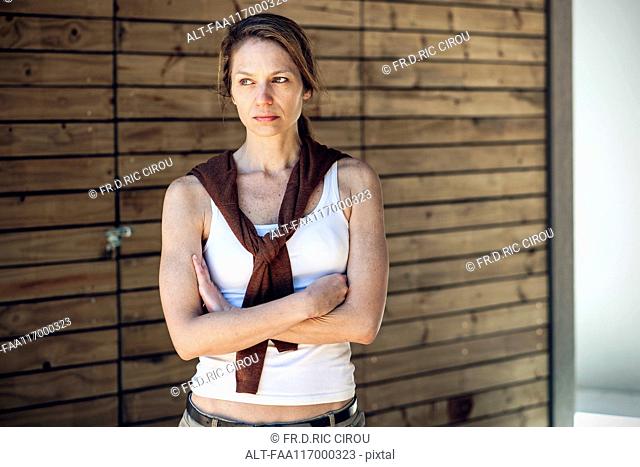Serious mature woman standing outdoors
