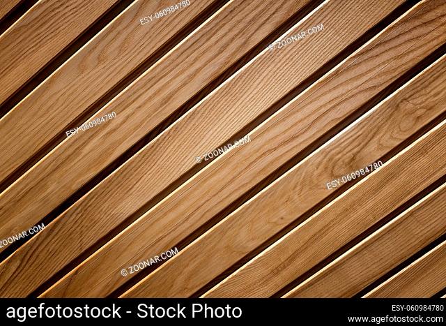 The background image is made of natural wood with a pronounced wood structure. Presented in close-up