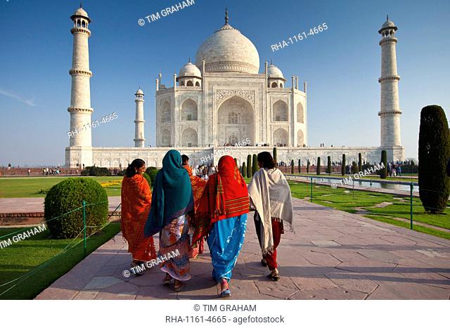 Indian tourists visiting The Taj Mahal mausoleum approach the southern view, Uttar Pradesh, India