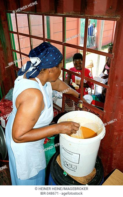 Food is handed out in a soup kitchen, Cape Town, South Africa