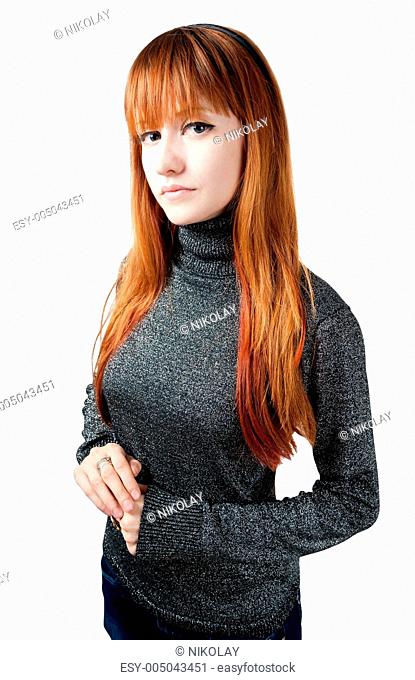 The beautiful girl with red long hair in a sweater