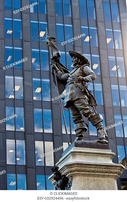 Statue of Paul de Chomedey with modern building background in Montreal, Canada