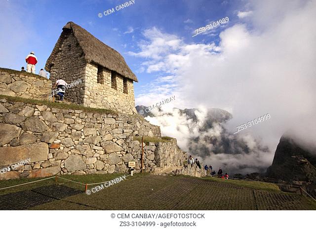 Tourists in front of the Hut of the Caretaker of the Funerary Rock, Machu Picchu, Cusco Region, Peru, South America