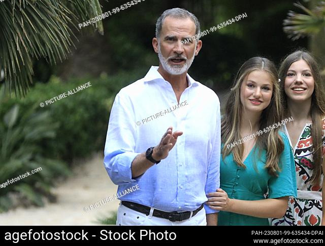 31 July 2023, Spain, Bunyola: Felipe VI (l-r), King of Spain, Leonor, Princess of Spain, and her sister the Infanta Sofia visit the village of Bunyola during...