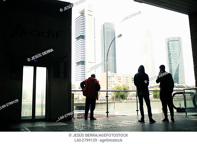 People at Chamartin train station, view of the Madrid financial center CTBA, Madrid, Spain