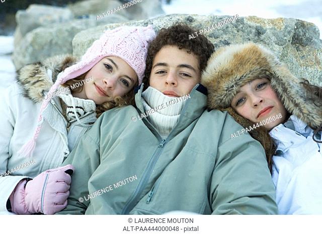 Young friends wearing winter clothing, portrait