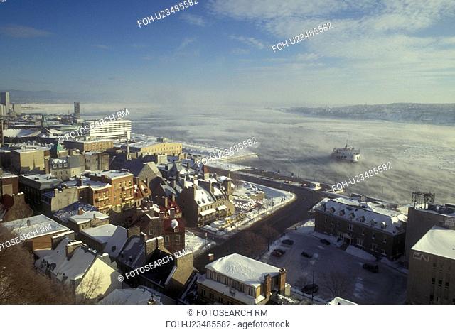 Canada, Quebec, View of the St. Lawrence River (Fleuve Saint-Laurent) and Petit Champlain in winter in Quebec City.