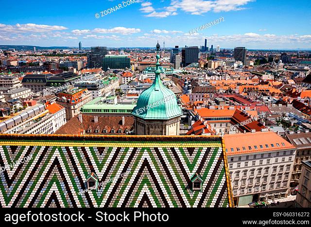 Austria, Vienna, capital city cityscape, tiled roof with pattern of St. Stephen's Cathedral