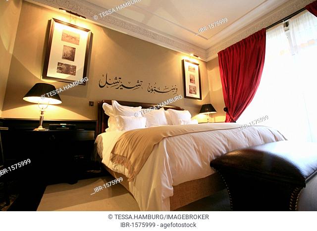 Churchill suite with the name of Winston Churchill in Arabic script above the bed, La Mamounia luxury hotel, Marrakech, Morocco, Africa
