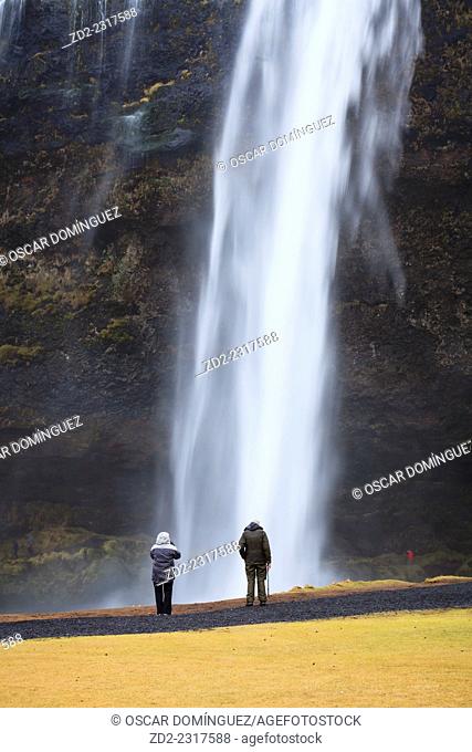 Tourists at Skogafoss Waterfall. Iceland
